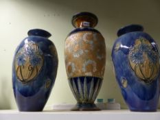 A large Doulton Lambeth stoneware baluster vase and another pair of Doulton Art Nouveau vases.