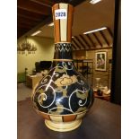 A Wedgwood bottle form vase of Eastern design, with stylized floral decoration. 30cm high