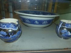 A Wedgwood blue and white Fallow Deer pattern large bowl and a pair of silver resist jugs in the