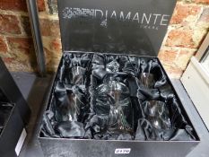 A boxed Diamante decanter and glasses together with another set similar.