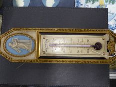 An unusual French gilt and painted wall thermometer by Wandenberg Freres, Paris. Oval blue jasper