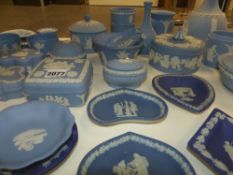 A collection of Wedgwood blue Jasper ware articles to include covered boxes, ashtrays, etc