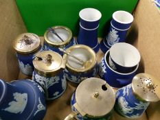 A group of small Wedgwood blue Jasper ware pieces to include open salts, various shakers, etc.. some