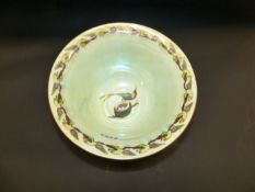 Daisy Makeig-Jones: A Wedgwood Fairyland green lustre pedestal bowl with humming bird decorations.