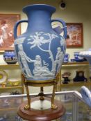 A Wedgwood blue Jasper ware Portland vase on conforming ormolu neo classical supports with a