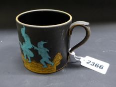 Daisy Makeig-Jones: A Wedgwood black Basalt cup decorated with brownies cavorting. Turquoise