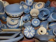 A large group of Wedgwood Jasper ware dresser boxes, vases, cups etc. Mostly blue and white but