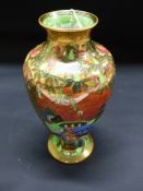 Daisy Makeig-Jones: A Wedgwood lustre baluster vase. Willow pattern Z53166. 22cm high