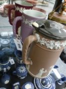 Three jugs by Wedgwood of similar design, one with plated cover, all in Jasper ware of different