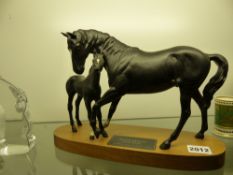 Beswick pottery figure group of Black Beauty and foal mounted on oval hardwood base