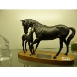 Beswick pottery figure group of Black Beauty and foal mounted on oval hardwood base