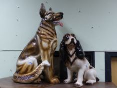 Two large decorative pottery figures of dogs, a spaniel and a German shepherd, height of largest.