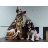 Two large decorative pottery figures of dogs, a spaniel and a German shepherd, height of largest.