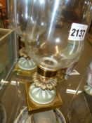 A pair of gilt brass mounted green Jasper ware candlesticks with clear glass storm shades. Height