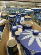 A collection of various Wedgwood blue Jasper ware spill vases, covered jars, candlesticks, etc.