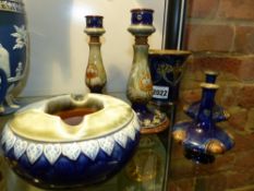 Six pieces of Doulton glazed stoneware, a pair of miniature vases, a pair of candlesticks. 16cm high
