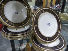 A Royal Doulton Dorchester pattern part service, gilt neo classical decoration with dark blue