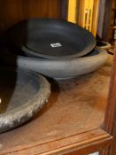 Four antique and later Wedgwood black basalt bowls. Diameter of largest 34cm