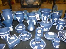 A Collection of Wedgwood indigo blue Jasper ware to include vases, covered boxes, jars,