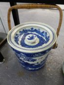 A Wedgwood blue and white pottery pail with lid and wicker swing handle. Fallow deer pattern. 25cm