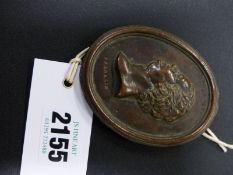 An antique oval bronze portrait plaque of Benjamin Franklin, possibly cast after the Wedgwood