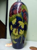 A large Moorcroft pottery lamp base with floral decoration. 38cm high