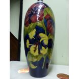 A large Moorcroft pottery lamp base with floral decoration. 38cm high