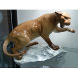 A Beswick pottery figure of a Mountain lion. 21cm high