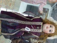 A TETE JUMEAU FASHION DOLL WITH BLUE EYES, OPEN MOUTH REVEALING TEETH, PIERCED EARS AND