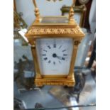 A GOOD QUALITY VICTORIAN STYLE BRASS CARRIAGE CLOCK BY TAYLOR & BLIGH.