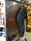 A 19TH.C.OAK TWIN PANELLED DOOR CORNER CABINET ON STAND