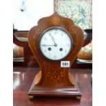AN EDWARDIAN MAHOGANY AND INLAID MANTLE CLOCK WITH ENAMEL DIAL AND FRENCH STRIKING MOVEMENT.