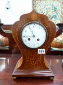 AN EDWARDIAN MAHOGANY AND INLAID MANTLE CLOCK WITH ENAMEL DIAL AND FRENCH STRIKING MOVEMENT.