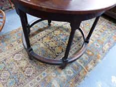 A 19TH.C.OAK CENTRE TABLE WITH CIRCULAR TOP OVER SIX TURNED LEGS UNITED BY PERIPHERAL STRETCHER.