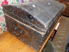 A 19TH.C.LEATHER COVERED DOME TOP TRAVELLING CHEST WITH IRON MOUNTS AND CARRYING HANDLES. W.69cms.