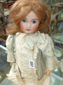 A FABRICATION FABRIC LANTERNIER AL& CO, LIMOGES CHERIE 7 DOLL WITH BLUE EYES, OPEN MOUTH AND