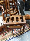A SET OF THREE VICTORIAN OAK LUGGAGE STANDS AND A SIMILAR LARGER EXAMPLE.