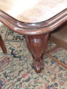 A GOOD MID - VICTORIAN MAHOGANY WIND OUT EXTENDING DINING TABLE ON STOUT CARVED CABRIOLE LEGS AND