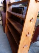 AN ELM BOOKCASE OF PEGGED CONSTRUCTION.