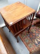 AN EDWARDIAN MAHOGANY REVOLVING BOOKCASE ON CABRIOLE LEG STAND.