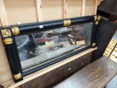 AN EBONISED AND GILT OVERMANTLE MIRROR