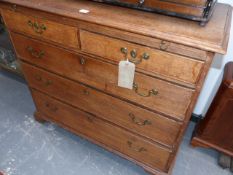 A GEORGIAN COUNTRY OAK CHEST WITH BRUSHING SLIDE, TWO SHORT ALIGNED DRAWERS ABOVE THREE LONG