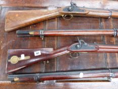 FOUR INDIAN PERCUSSION SERVICE MUSKETS AND A PERCUSSION CARBINE BY NICHOLSON. (5)