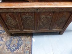 AN EARLY 18TH.C.OAK COFFER WITH FOUR PANEL CARVED FRONT.