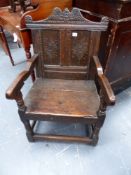A 17TH.C.OAK WAINSCOT CHAIR WITH CARVED PANEL BACK.