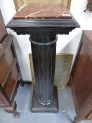 A PAIR OF 19TH.C.EBONISED MARBLE TOPPED DISPLAY PEDESTALS.
