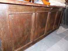 A LARGE OAK PANEL COFFER