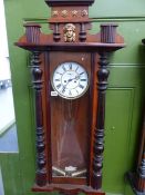 A VICTORIAN MAHOGANY CASED VIENNA WALL CLOCK WITH TWIN WEIGHT DRIVEN STRIKING MOVEMENT.