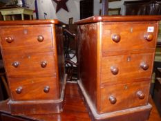 A PAIR OF MAHOGANY THREE DRAWER BEDSIDE TABLES.