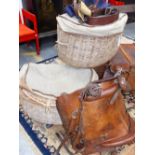 AN EXTREMELY LARGE PAIR OF CANVAS TOP WICKER PANNIERS.